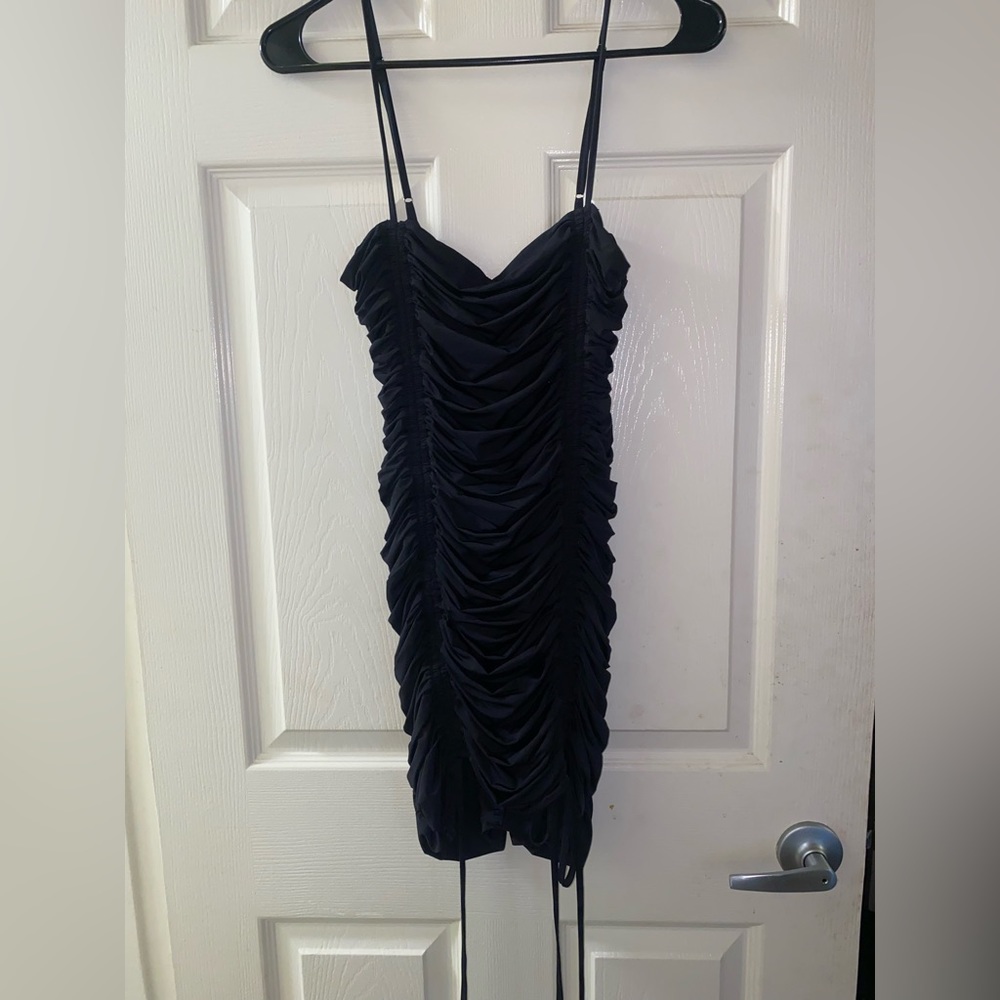 Tight fitting black mini dress